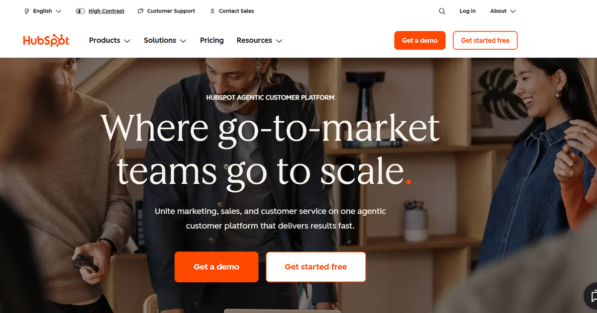 HubSpot homepage highlighting its AI-powered customer platform with marketing, sales, and customer service solutions alongside demo and free signup buttons.